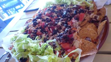 Steps to prepare loaded nachos for gatherings